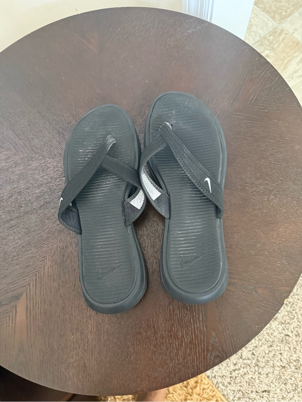 Nike Black Women's Slip-On Flip Flops with Subtle Silver Accents